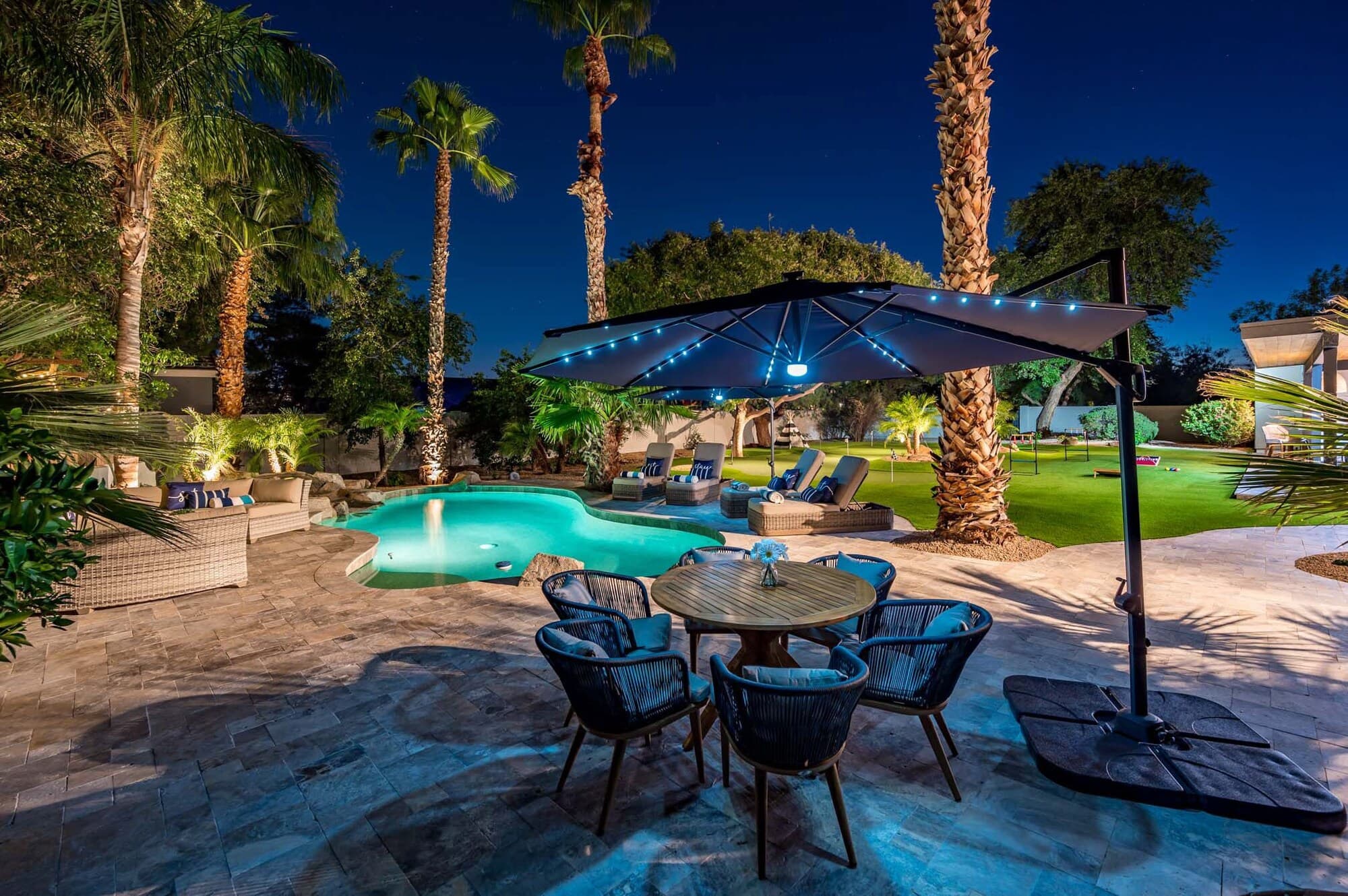 Desert Resort Phoenix — private resort pool glowing at twilight beneath the palms