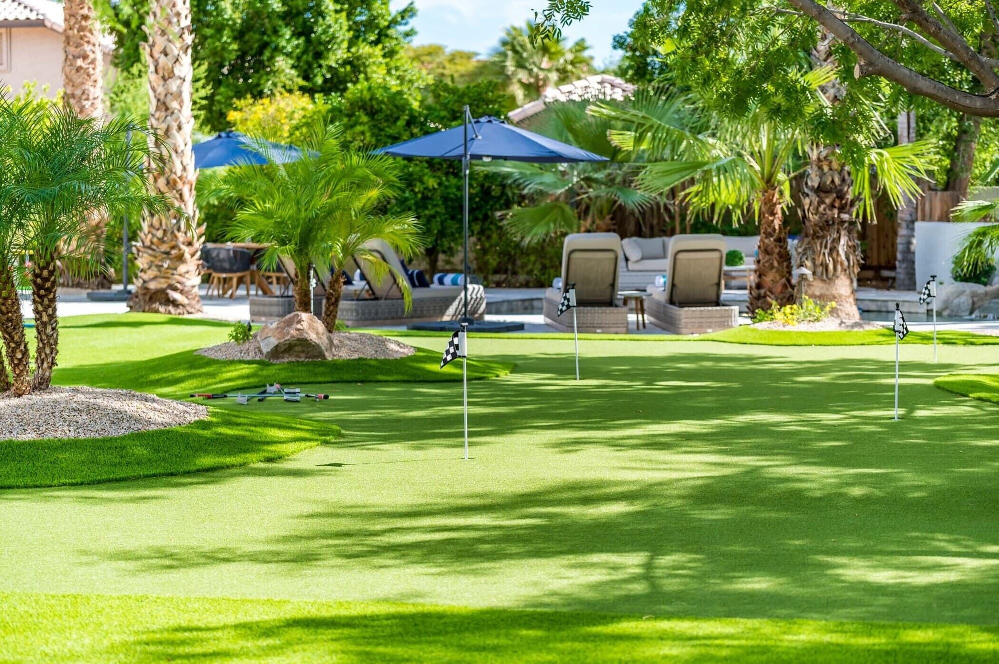 Lush green lawn and putting green on the property grounds