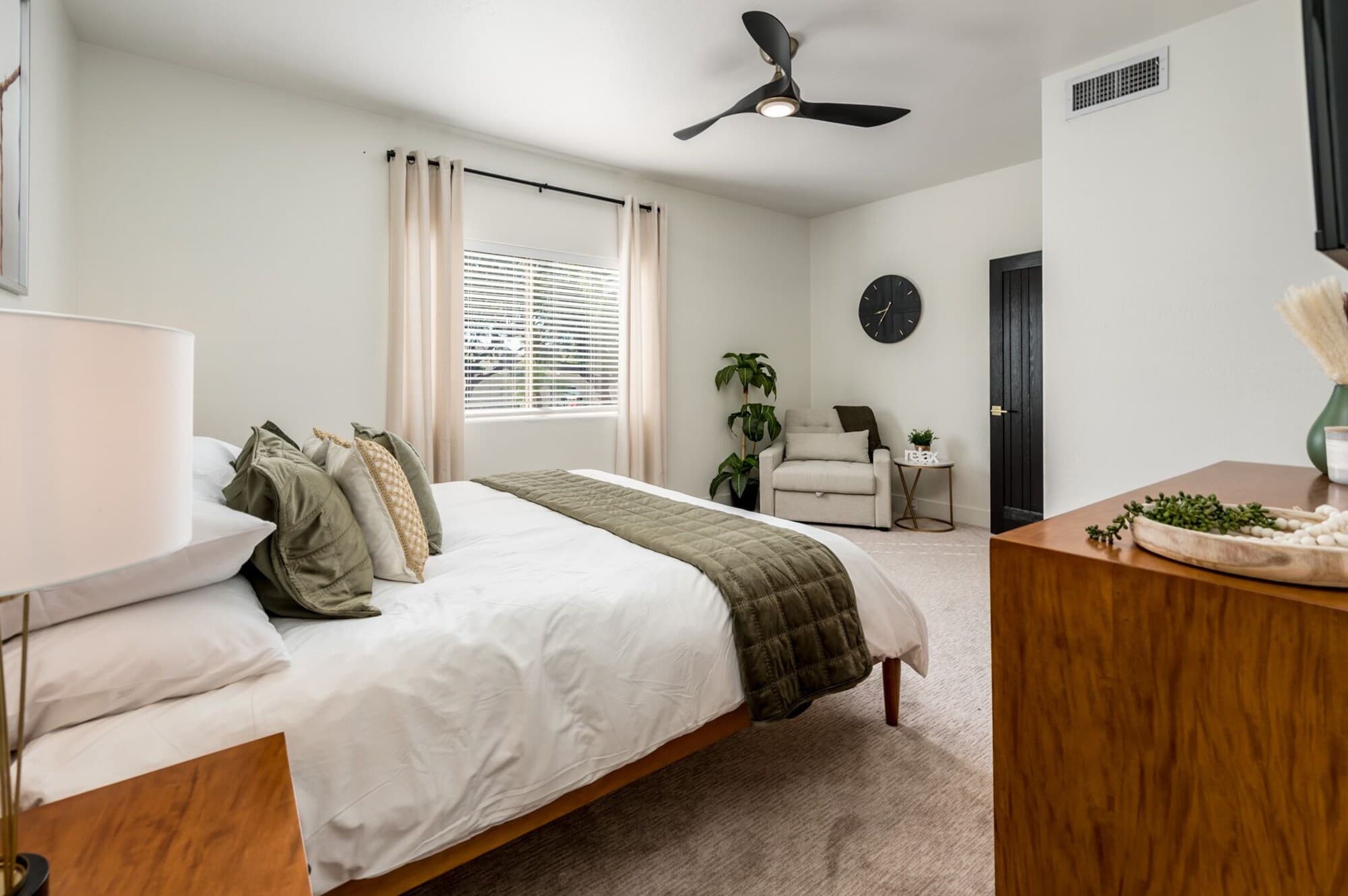Pool-view bedroom with twin fold-out sofa chair