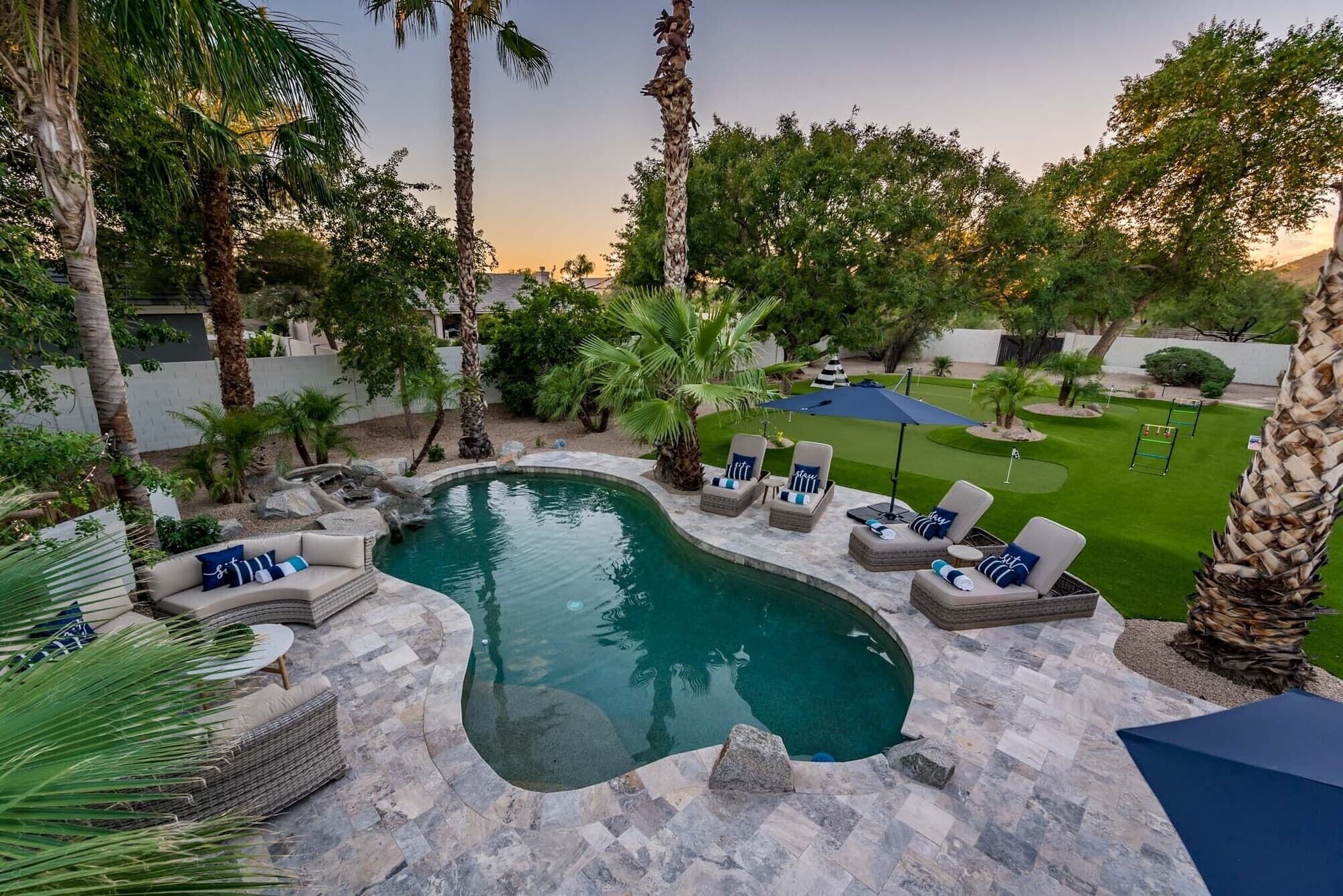 Twilight backyard with fire features